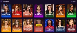 SpinBet Live Casino lobby showing games like Blackjack, Baccarat, Roulette, Dragon Tiger, and Poker from Pragmatic Play and Evolution